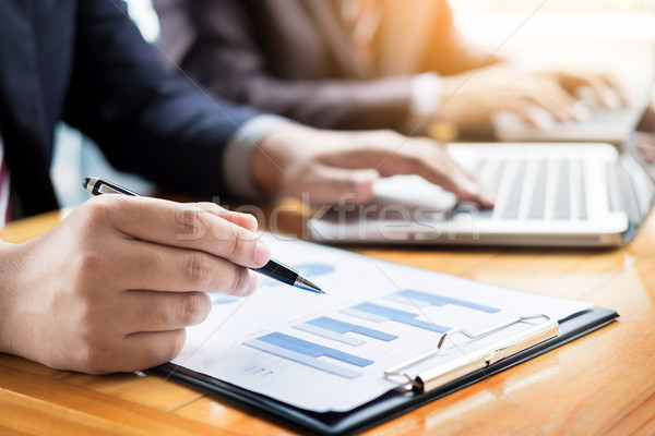 Businessman team working at office desk and using a digital comp Stock photo © snowing