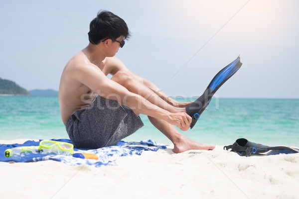 Vacation Backside of man holding snorkeling gear on tropical on  Stock photo © snowing