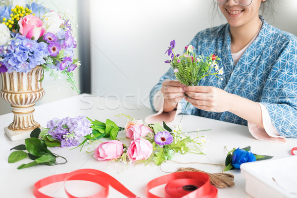 young women business owner florist making or Arranging Artificia Stock photo © snowing