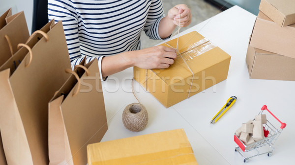 Business owner woman working online shopping prepare product pac Stock photo © snowing