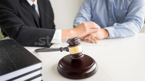 Judge gavel with lawyers advice legal at law firm in background. Stock photo © snowing