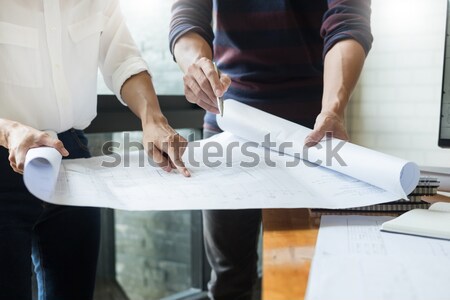 professional architects working on blueprint discussing construc Stock photo © snowing