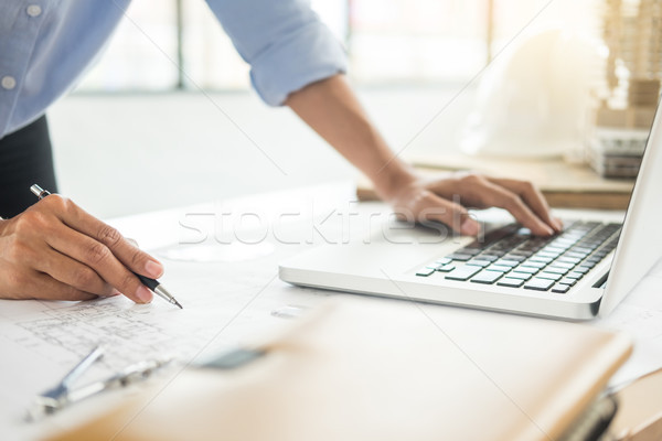 Person's engineer Hand Drawing Plan On Blue Print with architect Stock photo © snowing