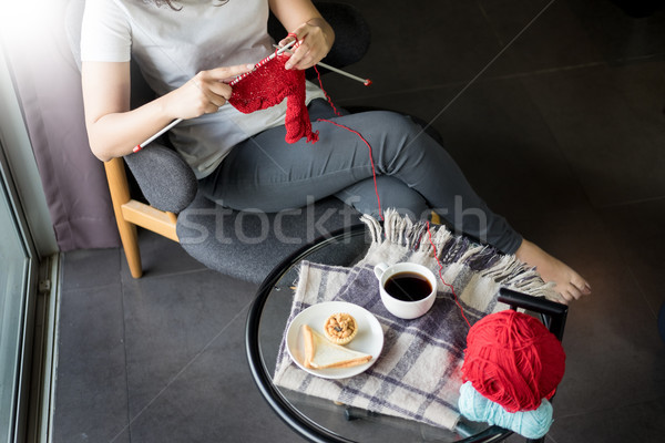 young woman’s hands knitting warm sweaters. Sitting on old arm Stock photo © snowing