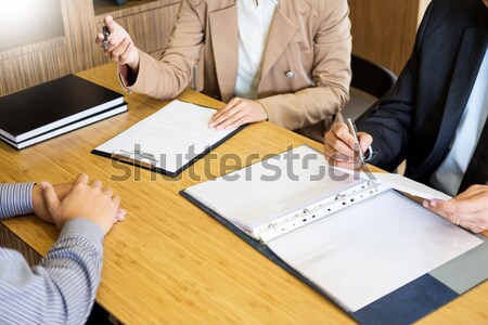 young man explaining about his profile to business managers sitt Stock photo © snowing
