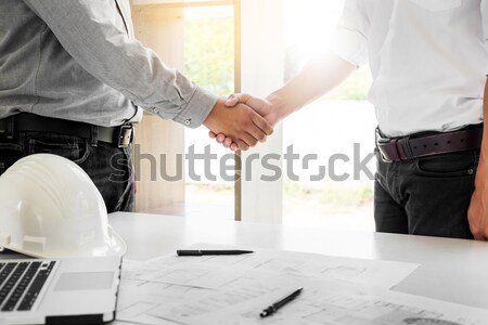 architecture and home renovation concept - builder with blueprin Stock photo © snowing