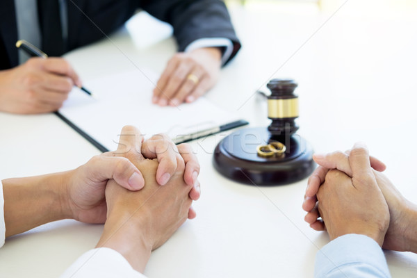 Angry couple arguing telling their problems to Judge gavel decid Stock photo © snowing