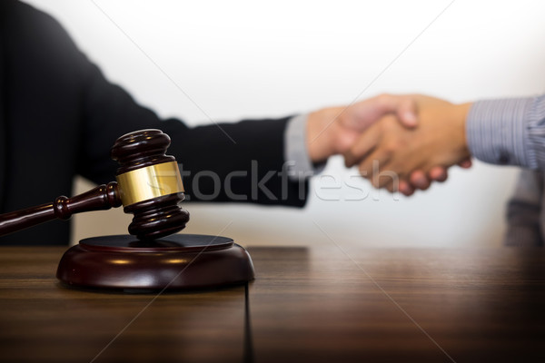 Gavel Justice hammer on wooden table with judge and client shaki Stock photo © snowing