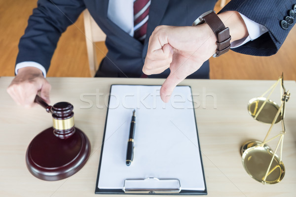 Law court or justice concept. Portrait lawyer making thumb down  Stock photo © snowing