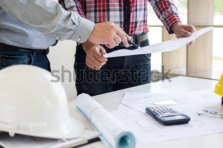 Close-up Of Person's engineer Hand Drawing Plan On Blue Print wi Stock photo © snowing