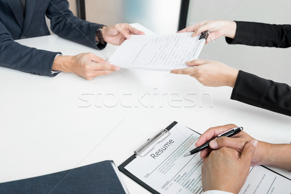 Hands of man giving application portfolio to HR man in office fo Stock photo © snowing