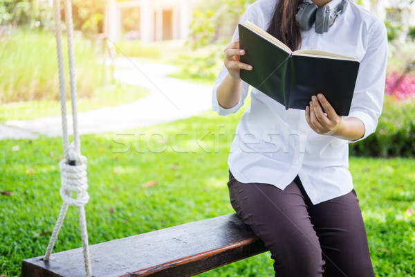 Pretty relaxed young beautiful woman reading a book in the garde Stock photo © snowing