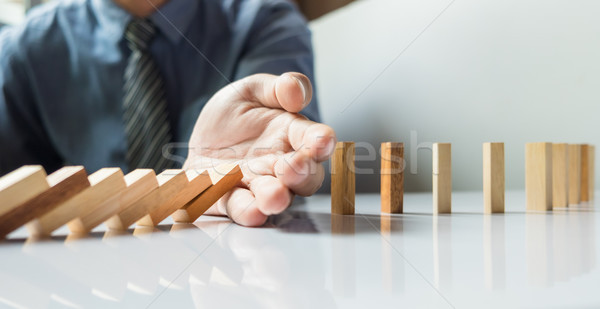 Stock photo: businessman hand stop dominoes continuous toppled or risk with c