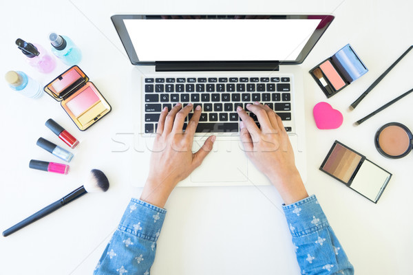 top view of women using laptop for searching cosmetic informatio Stock photo © snowing