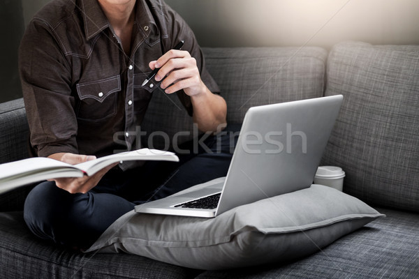Stock photo: Handsome Young Man Sitting on the Living Room Couch, Casual youn