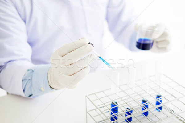 Scientist dropping adds the   reagent from the dropper to test t Stock photo © snowing