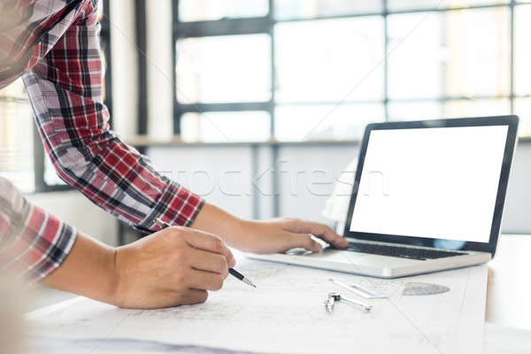 Close-up Of Person's engineer Hand Drawing Plan On Blue Print wi Stock photo © snowing