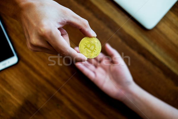 Stock photo: hand exchange golden metal Bitcoin crypto currency investment- s