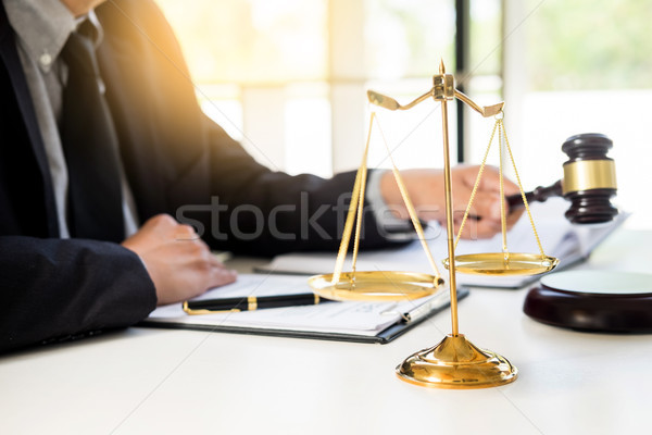 Male Judge lawyer In A Courtroom Striking The Gavel on sounding  Stock photo © snowing