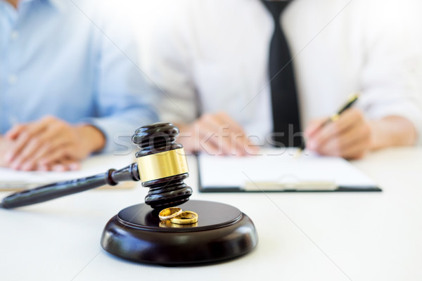 Angry couple arguing telling their problems to Judge gavel decid Stock photo © snowing