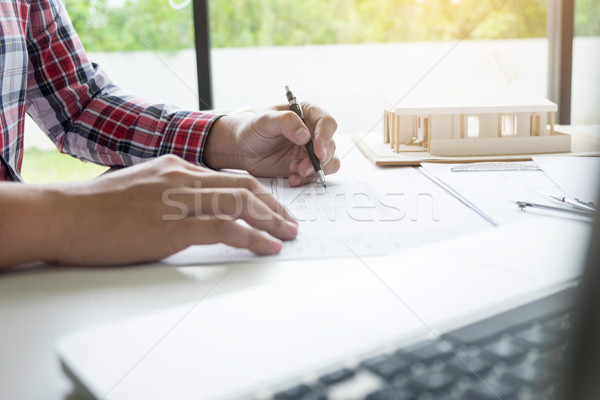 Stock photo: Person's engineer Hand Drawing Plan On Blue Print or working pro