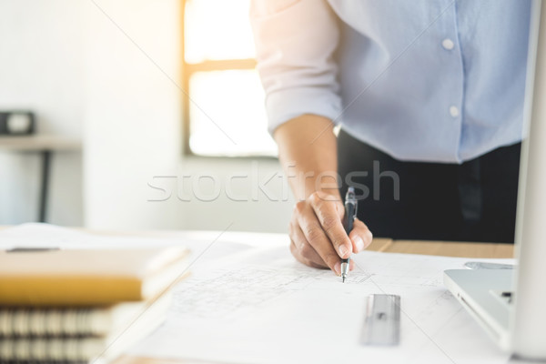 Person's engineer Hand Drawing Plan On Blue Print with architect Stock photo © snowing
