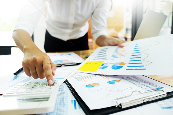 business men working on wooden desk(table) with notebook compute Stock photo © snowing