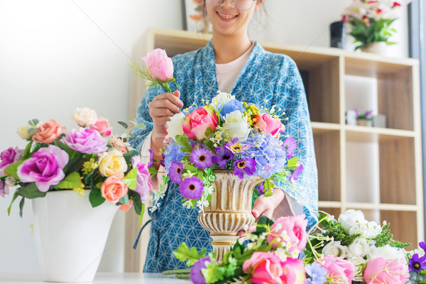 young women business owner florist making or Arranging Artificia Stock photo © snowing