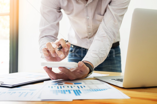 business men working on wooden desk(table) with notebook compute Stock photo © snowing
