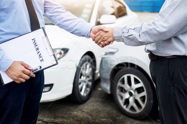 Customer shake hand with auto insurance agents after agreeing to Stock photo © snowing
