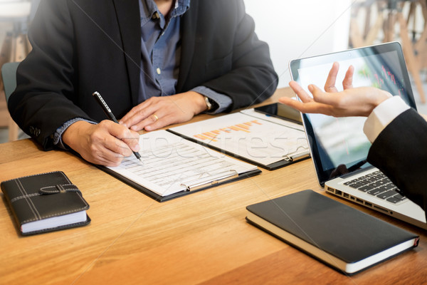 Businessman team working at office desk and using a digital comp Stock photo © snowing