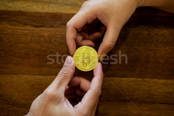 Stock photo: hand exchange golden metal Bitcoin crypto currency investment- s