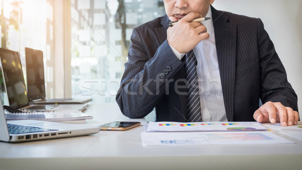 Working process startup. Businessman working at the wood table w Stock photo © snowing