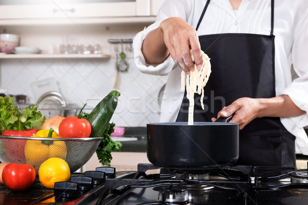 Chef Cutting cook Homemade makes dough fresh Pasta. Stock photo © snowing