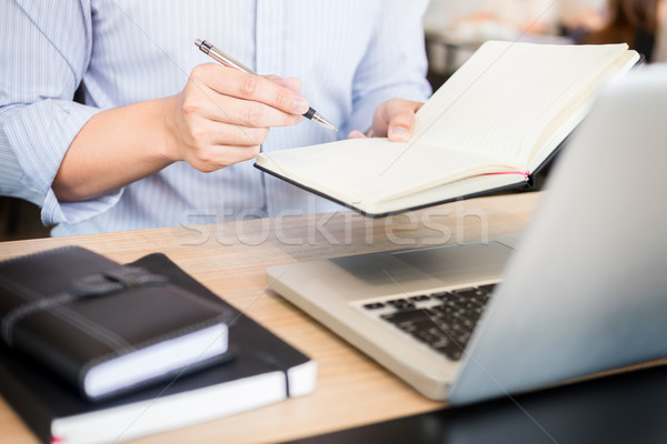 business men working on wooden desk(table) with notebook compute Stock photo © snowing