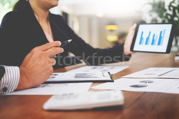 Business man and woman discuss about the financial plan on digit Stock photo © snowing