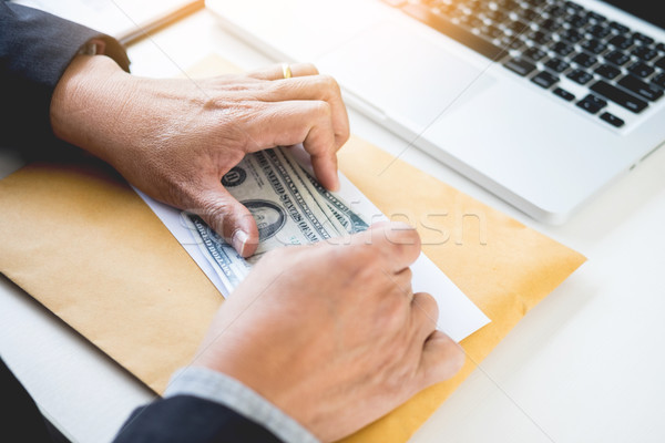 business man counting money at the table, accounting concept Stock photo © snowing