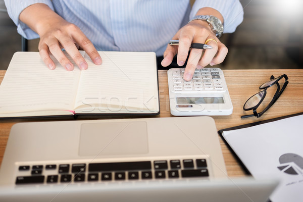 business men working on wooden desk(table) with notebook compute Stock photo © snowing