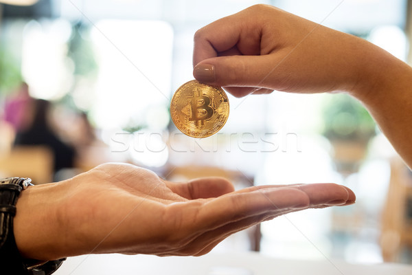 hand exchange golden metal Bitcoin crypto currency investment- s Stock photo © snowing