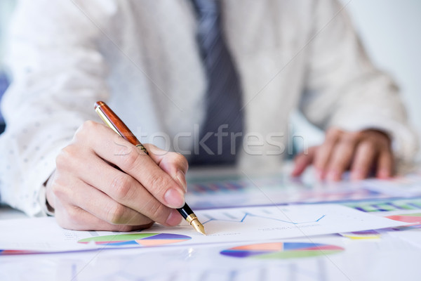 Stock photo: Working process startup. Businessman working at the wood table w