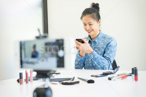 woman present beauty product and broadcast live video to social  Stock photo © snowing