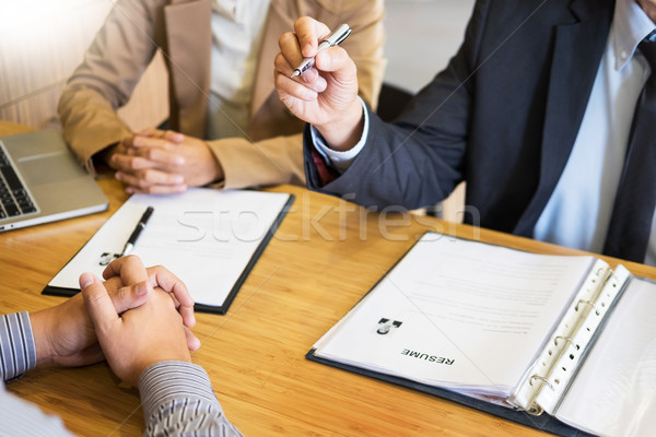 young man explaining about his profile to business managers sitt Stock photo © snowing