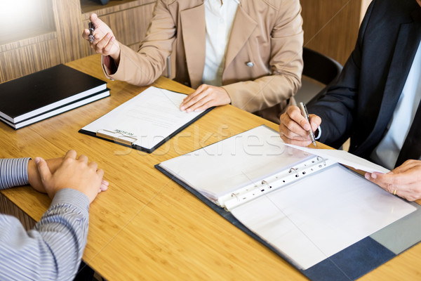 young man explaining about his profile to business managers sitt Stock photo © snowing