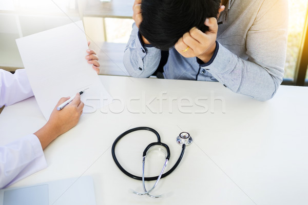 Patient receiving bad news, he is desperate and crying, Doctor s Stock photo © snowing