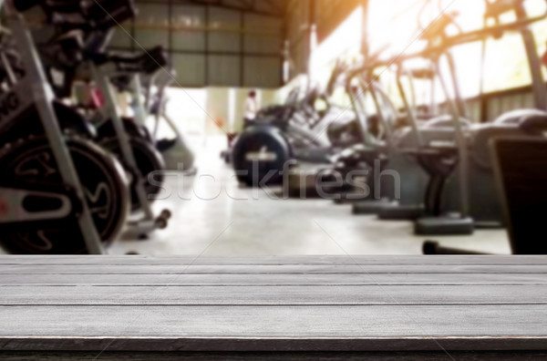 Wooden table on blurred background of fitness gym interior of mo Stock photo © snowing