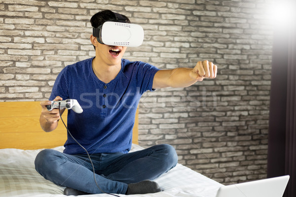The VR headset design is generic and no logos, Man wearing virtu Stock photo © snowing