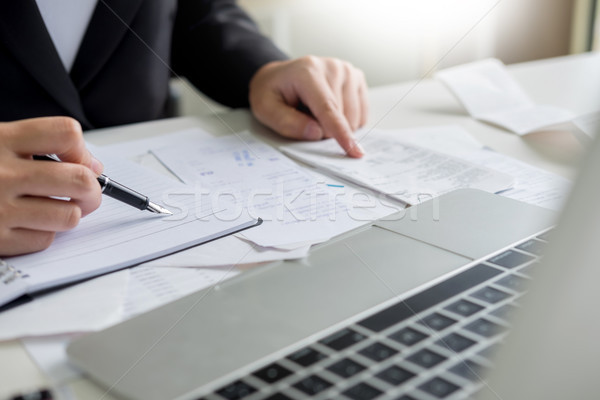 business woman accountant or banker making calculations Bills. d Stock photo © snowing