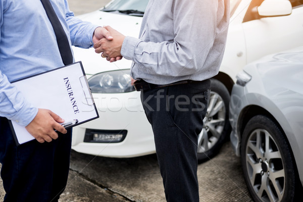 Customer shake hand with auto insurance agents after agreeing to Stock photo © snowing