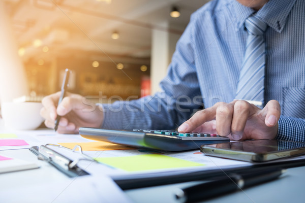 Business finance man calculating budget numbers, Invoices and fi Stock photo © snowing