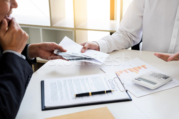 Corrupted businessman, or politician bribe in the form of hundre Stock photo © snowing